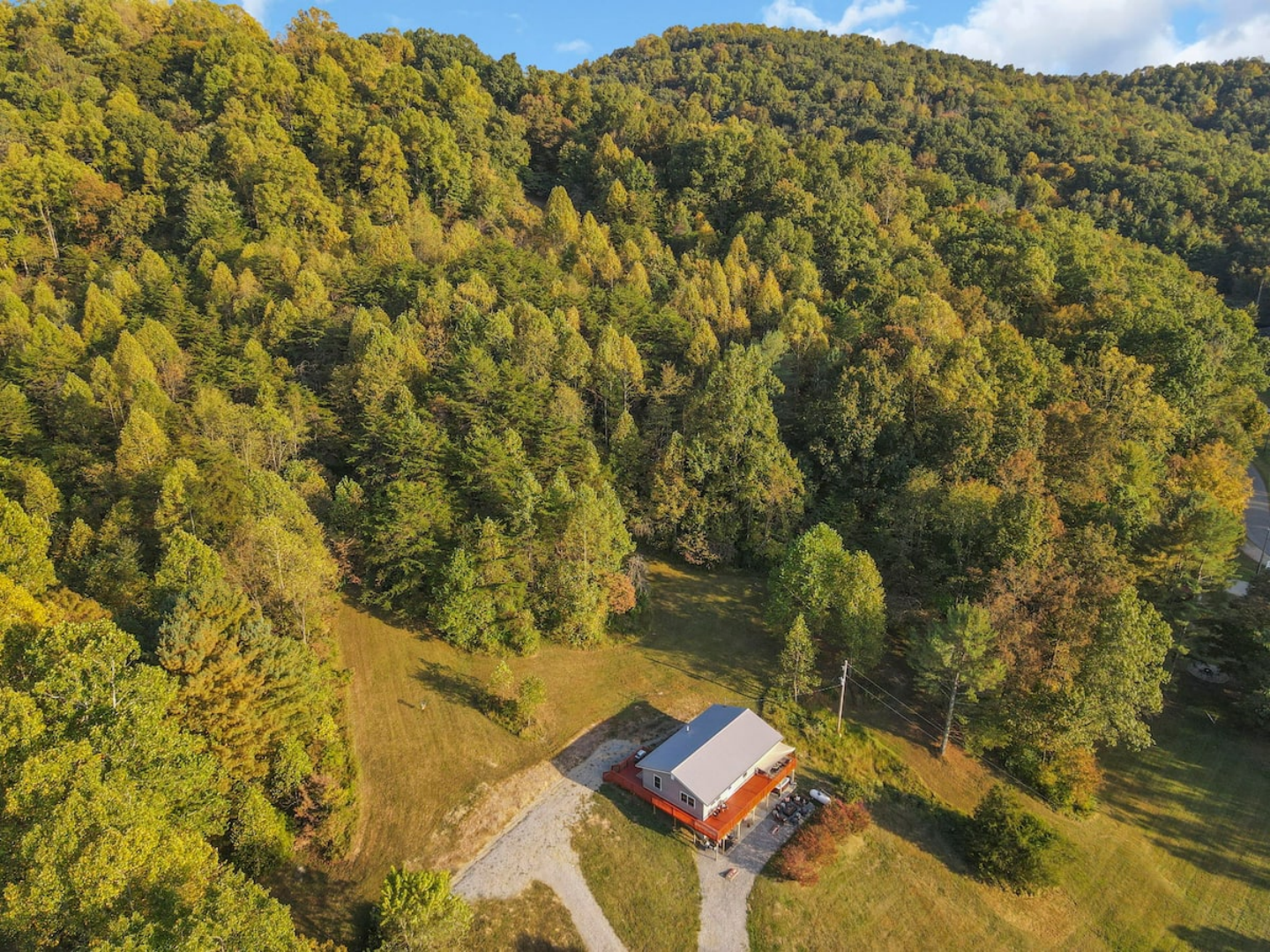 Above-deck seating overlooking scenic hillside